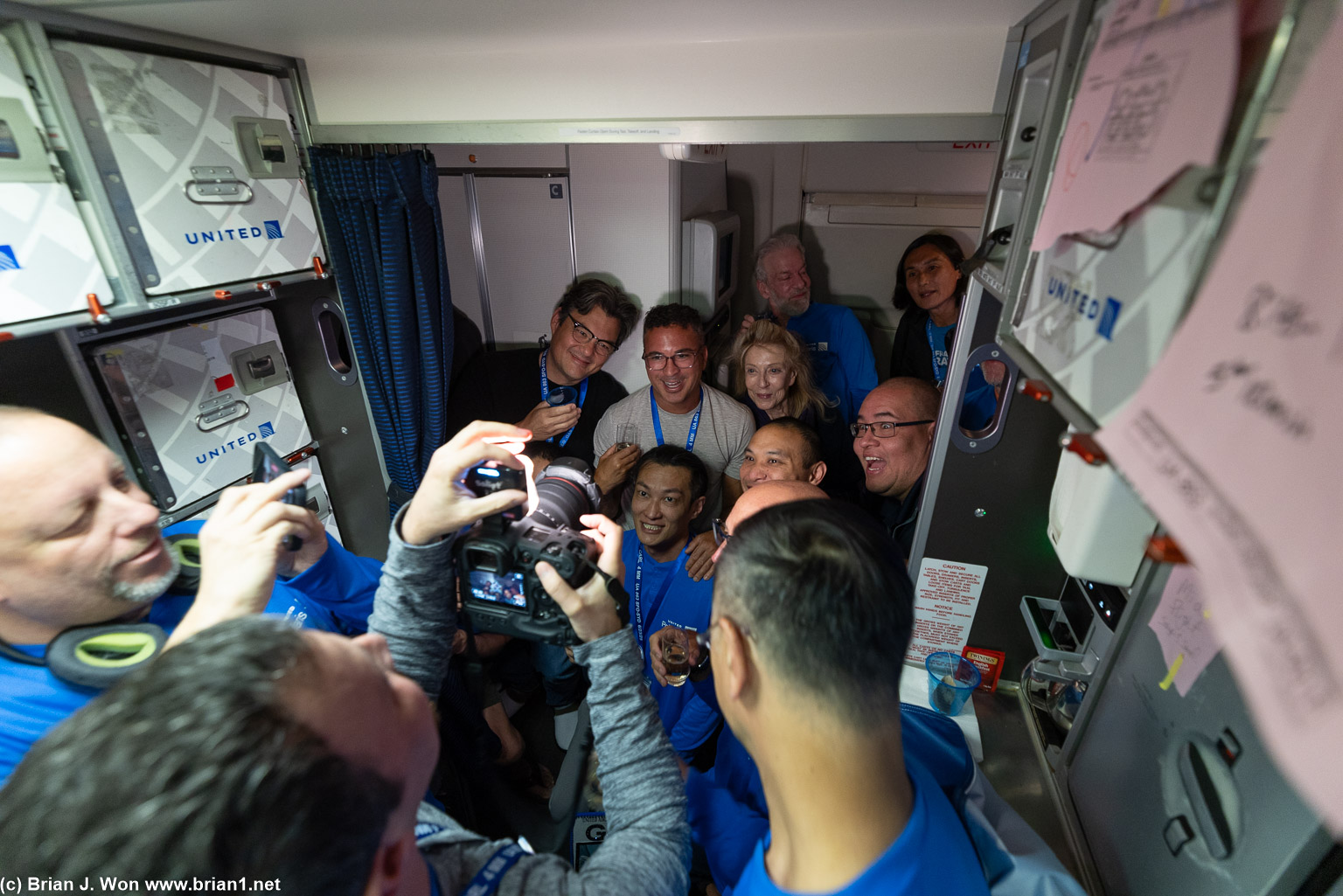 Bruce, Riya, Philip, Brian, Kathie, Scott, Joe, and more squeezing into a photo with Carl.