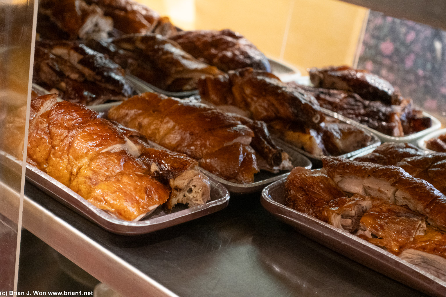 Shelf full of roast duck.