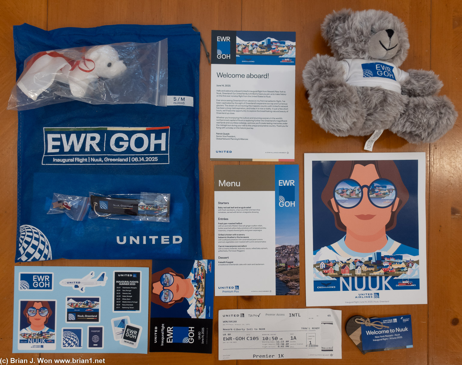 The spread of EWR-GOH inaugural flight swag.