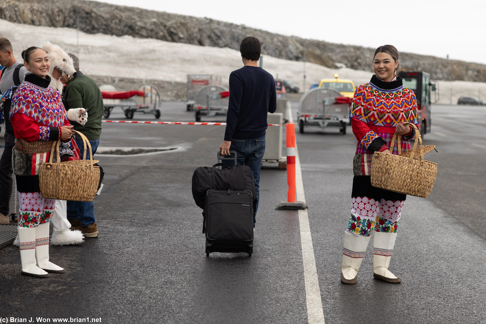 Traditional dancers and musicians greeting inaugural flight passengers.