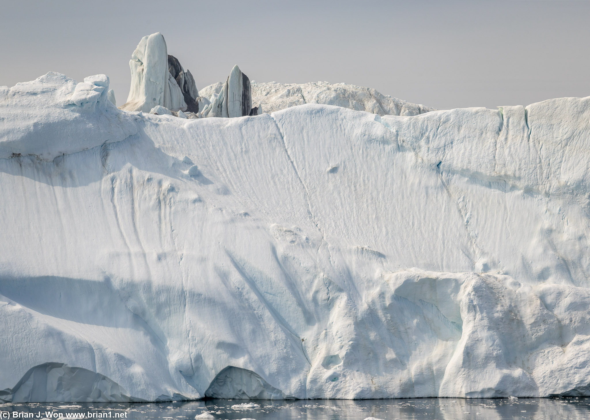 Some icebergs are so large they have their own surface features that stand tall on their own.