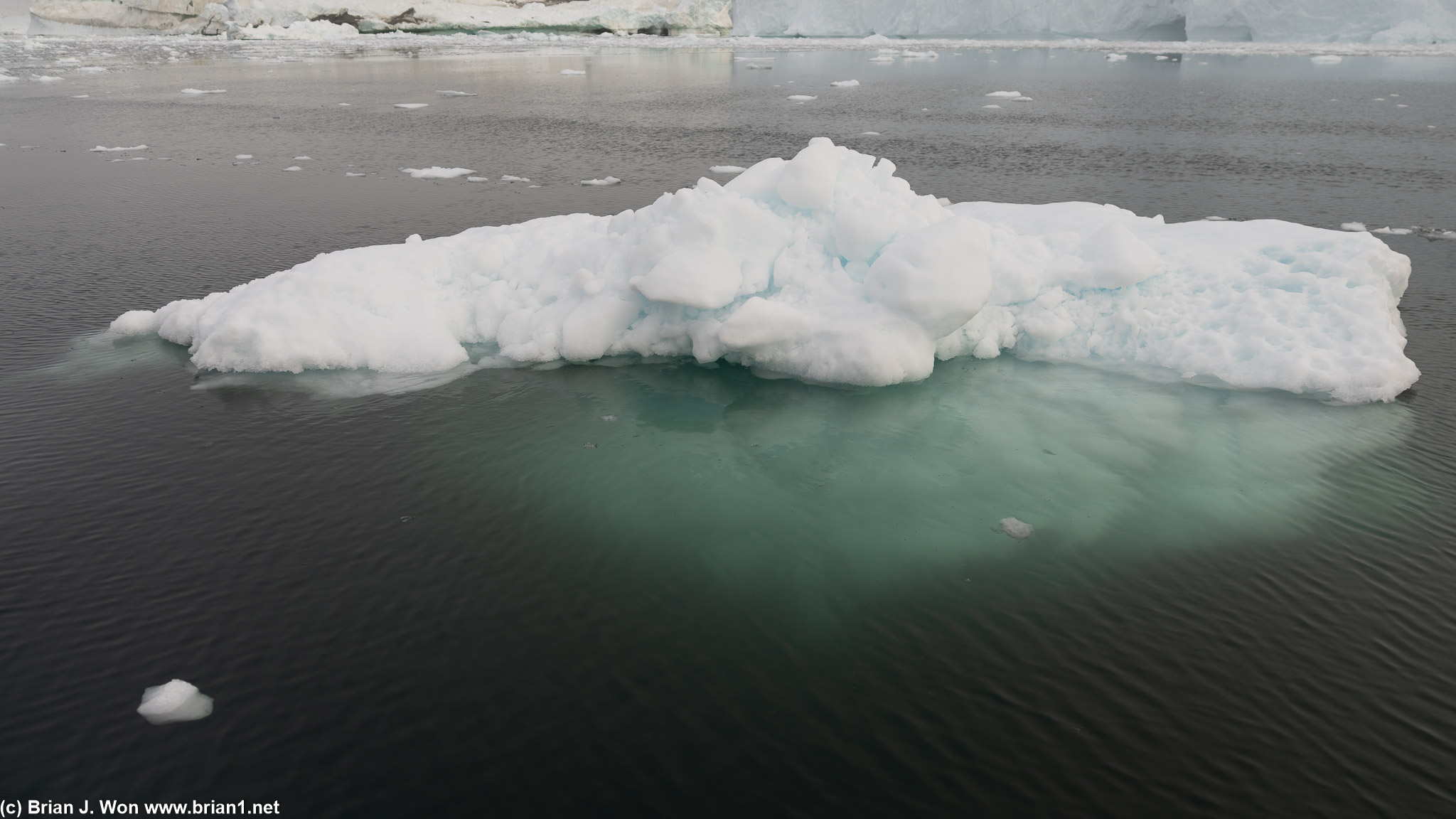Less-common glimpse of just how much of an iceberg is under water (90%).