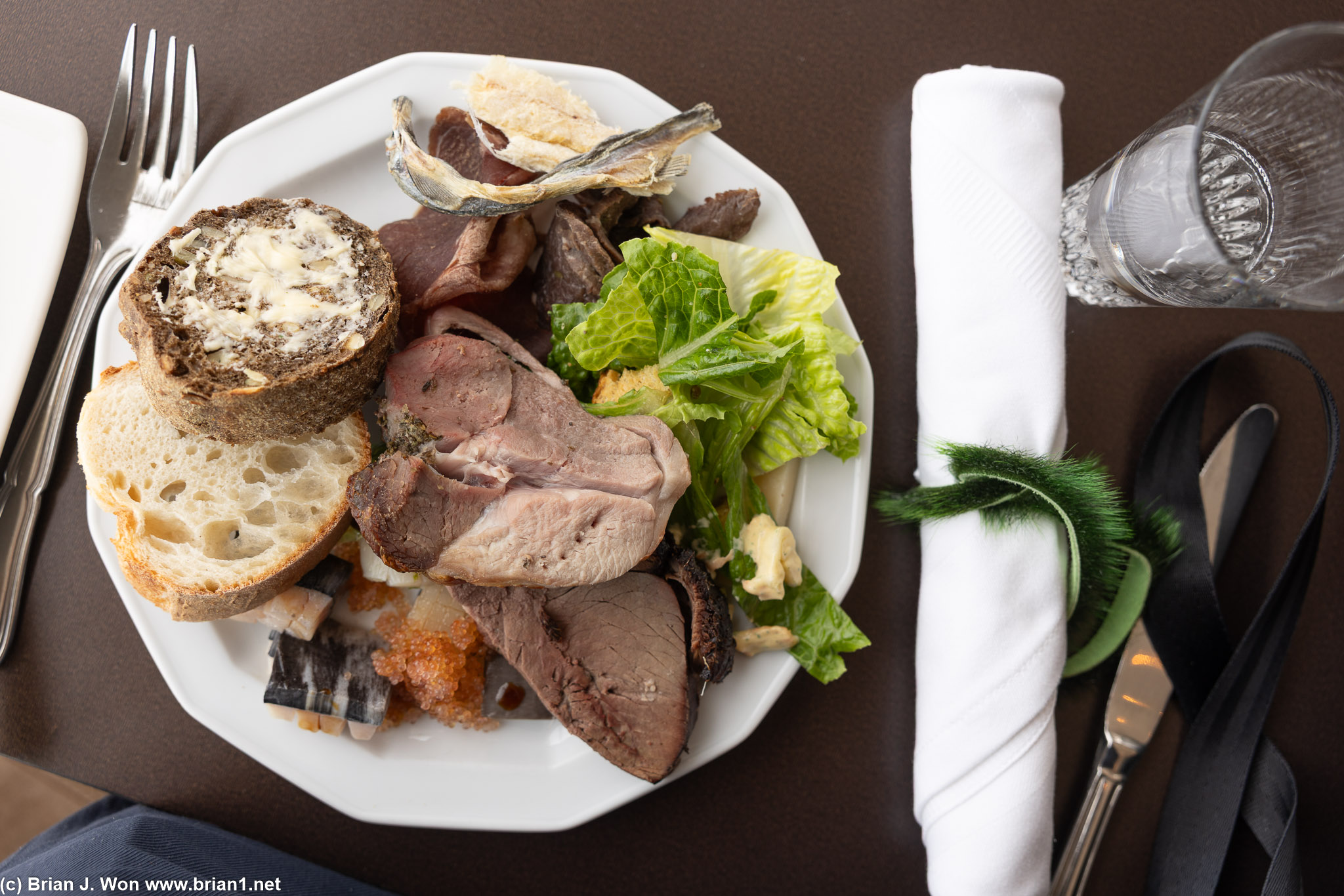 From top/left-to-right, ammassat, musk ox, caribou, lamb, reindeer (?), scallop, porpoise, narhwal.