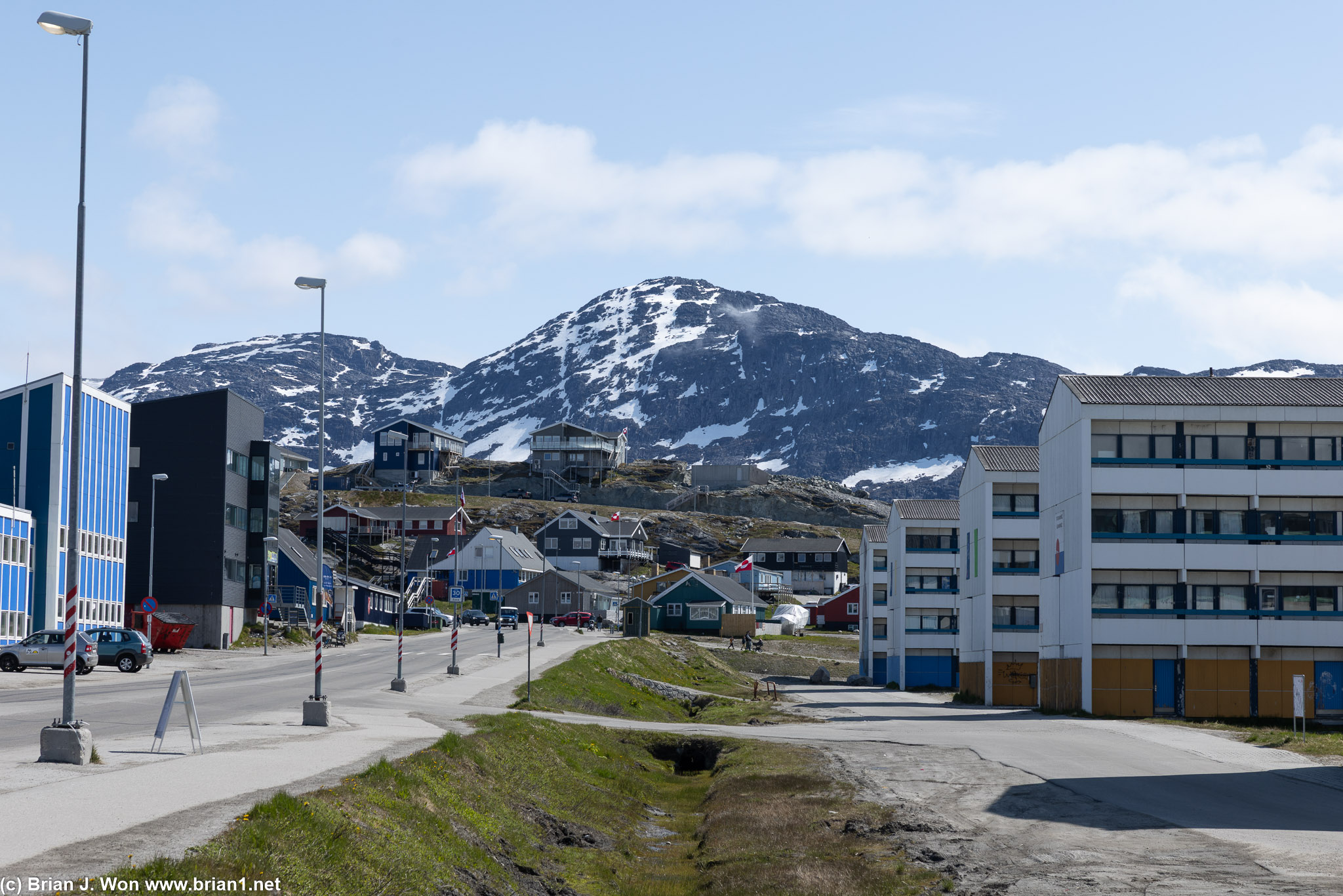 Looking down one of the main streets, with mountains in the background.