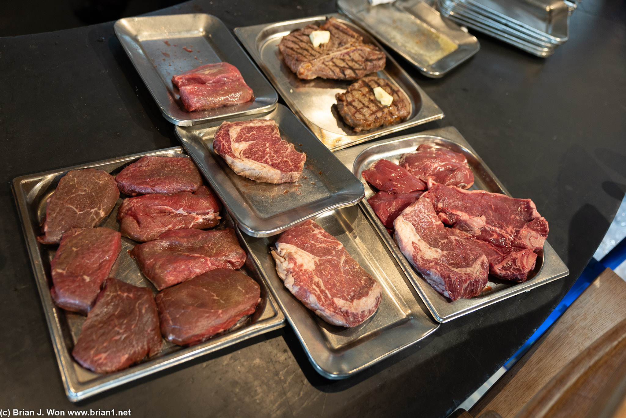Not sure exactly what is here, but looks like two kinds of beef (porterhouse, ribeye), other trays are possibly musk ox and reindeer.