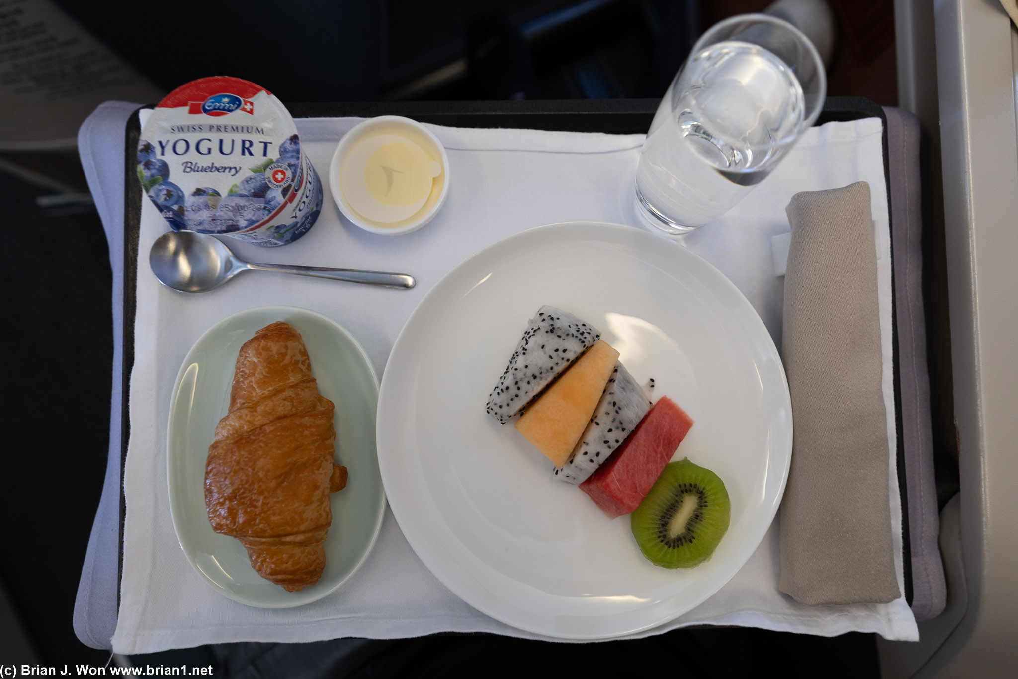 Opening course, fresh fruit, yogurt, croissant.