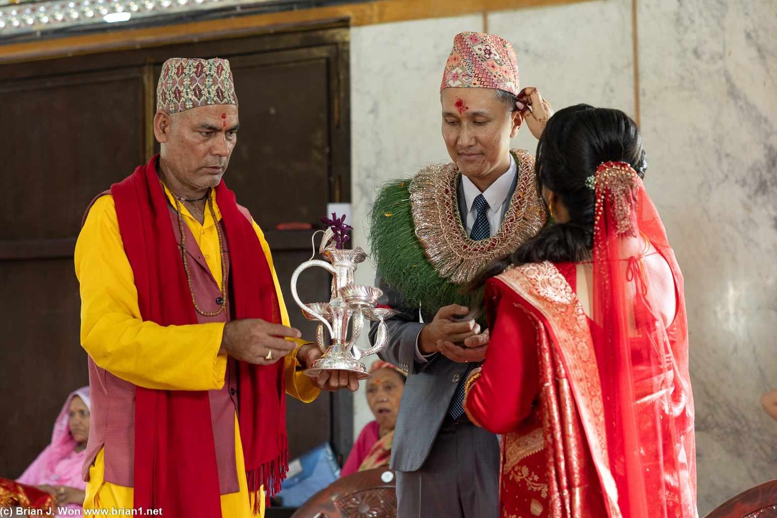 Bhatta with the bride and groom.