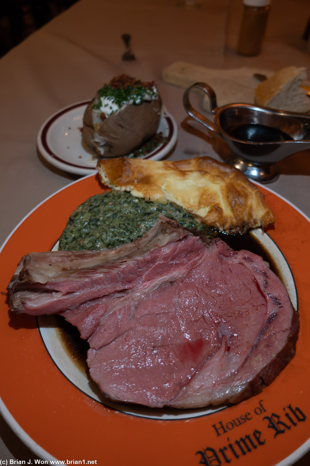 King Henry VIII (16oz) cut with creamed spinach, yorkshire pudding, and loaded baked potato.