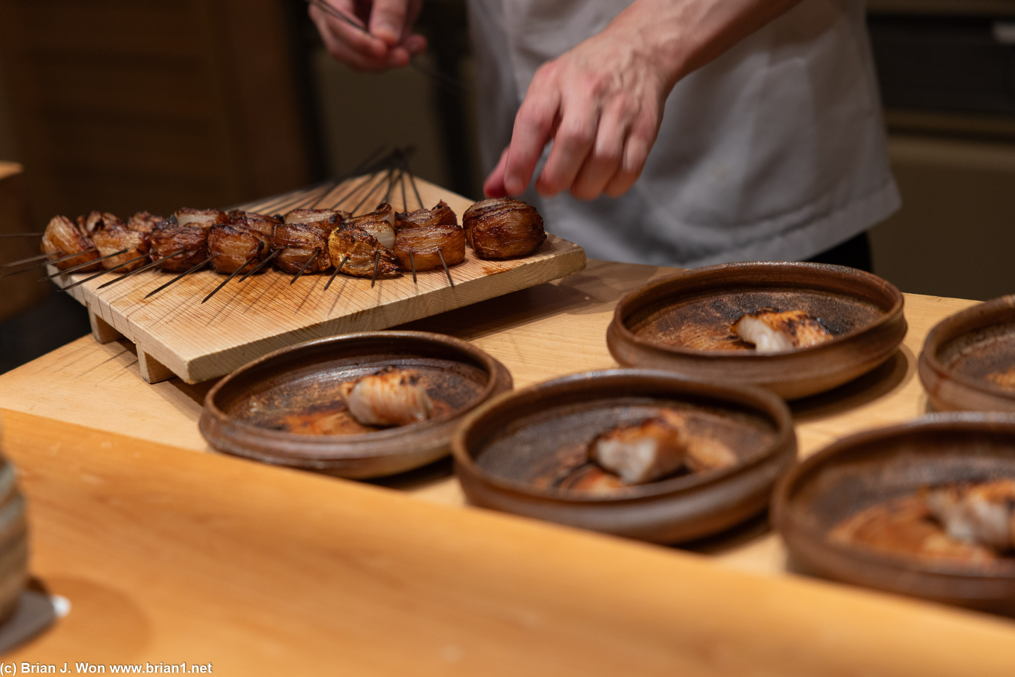 Charcoal grilled kinki (rockfish) with onion.