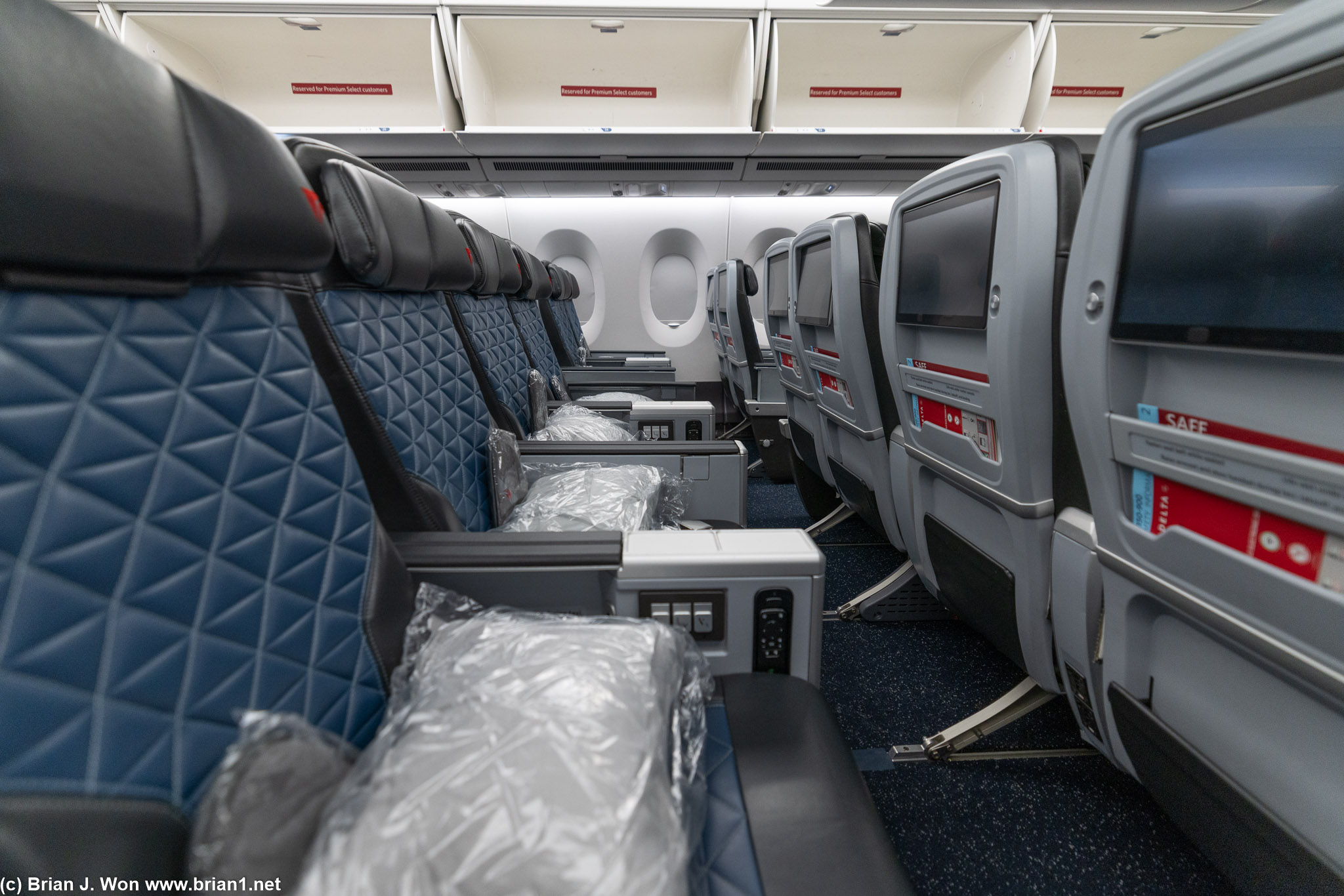 38" of pitch is typical for premium economy. Bulkhead rows defintely the way to go.