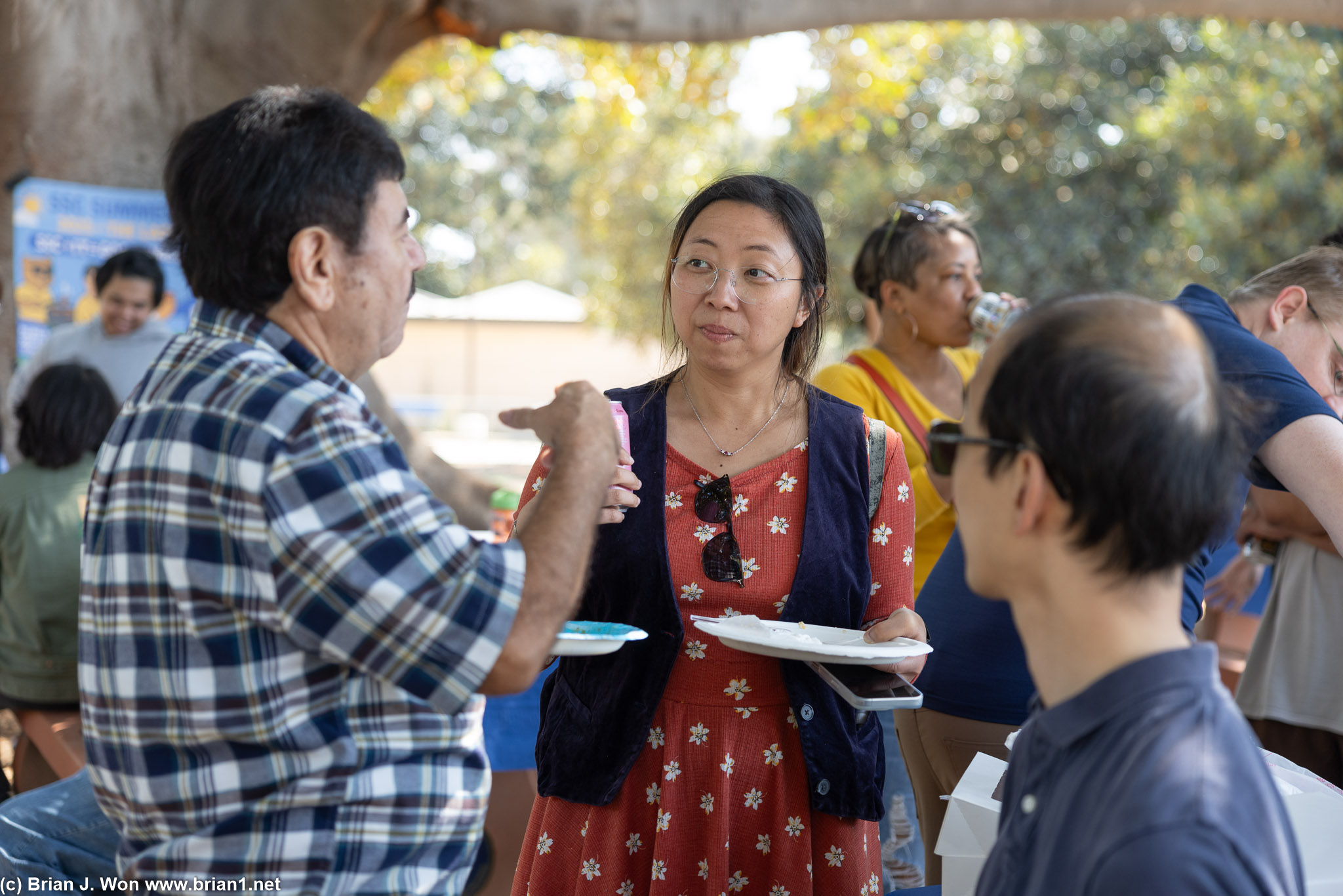 Kai and his wife talking with another SSCERT alumnus, Carlos.