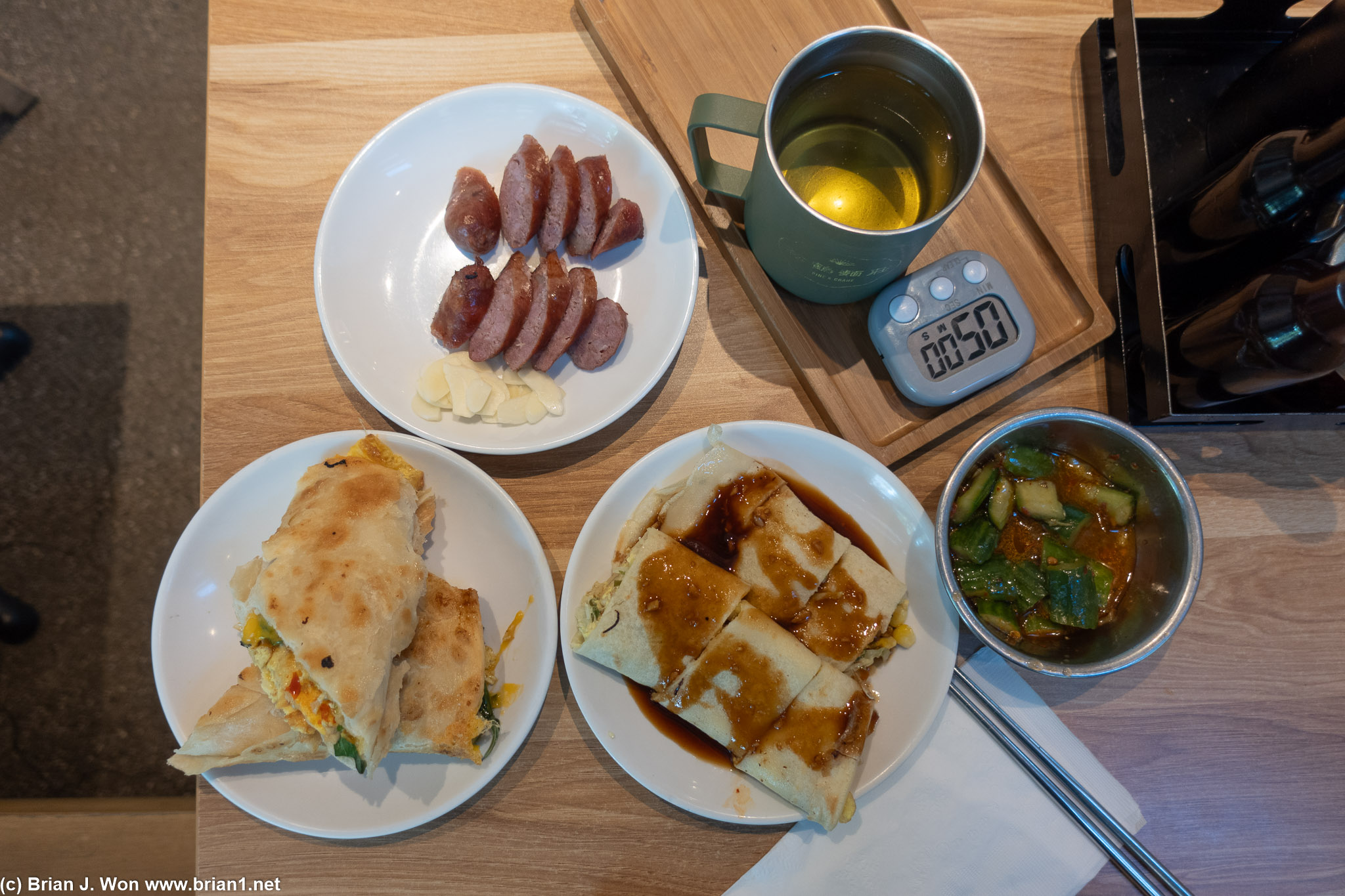 The spread. Taiwanese sausage, chrysanthemum tea, cucumber salad, dan bing, thousand layer pancakes.
