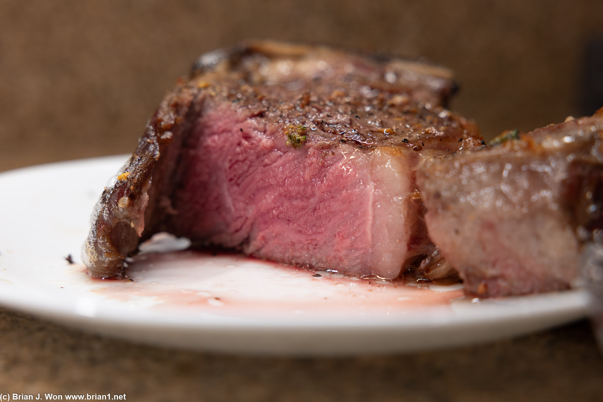 About 15 minutes a side in a 350F oven for medium-rare.