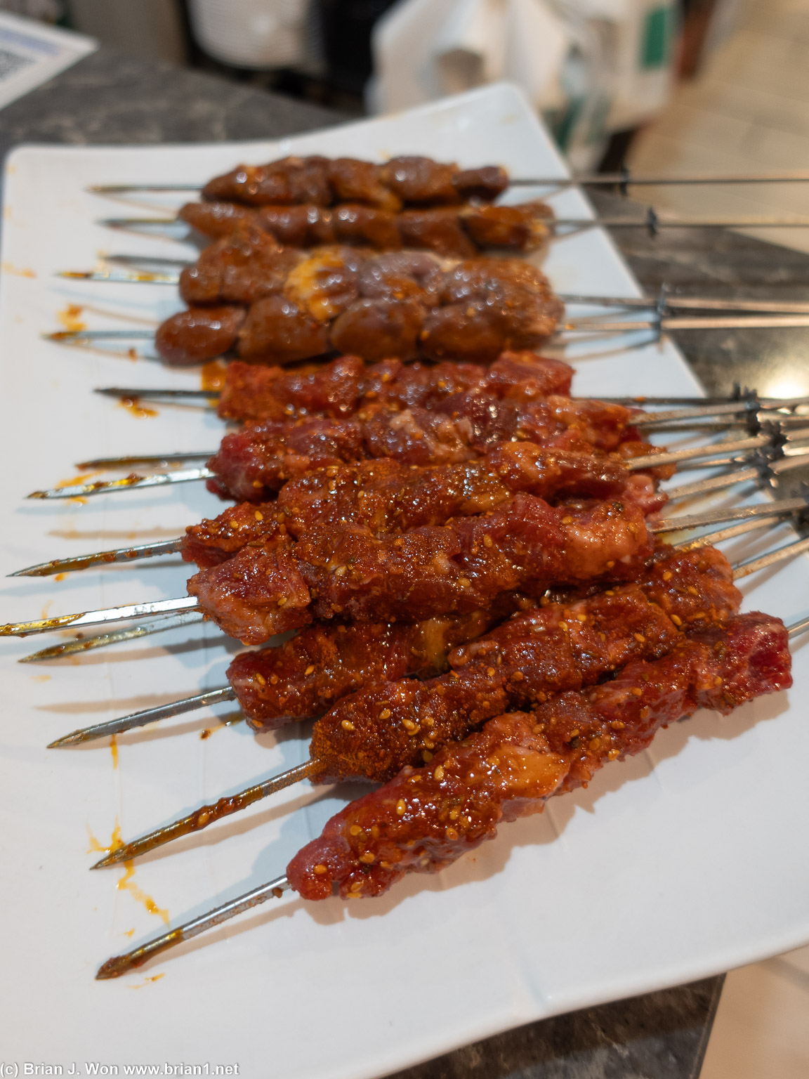 Beef and lamb in front, chicken hearts in back.