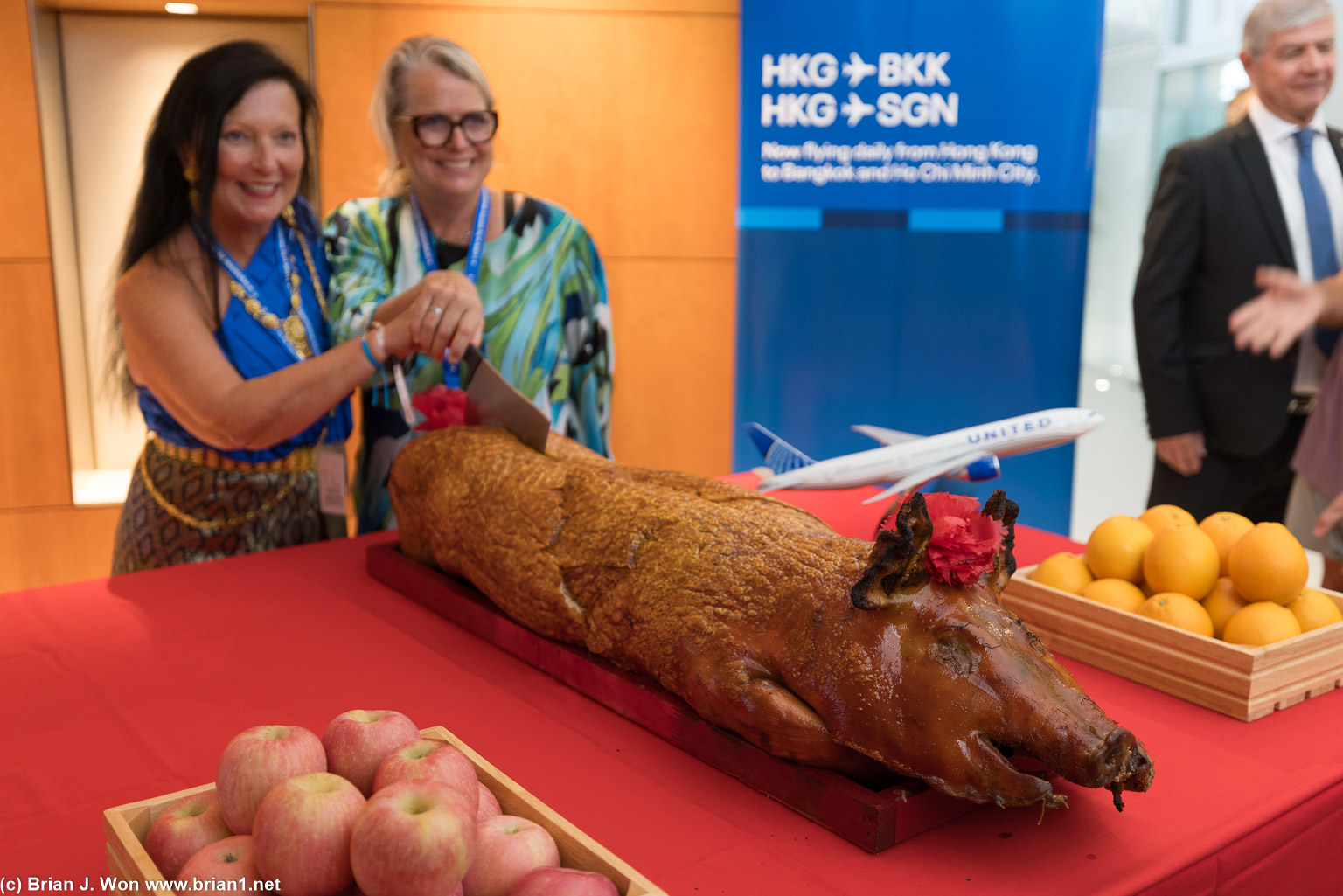 Chantal and Amy posing with the roast pig.
