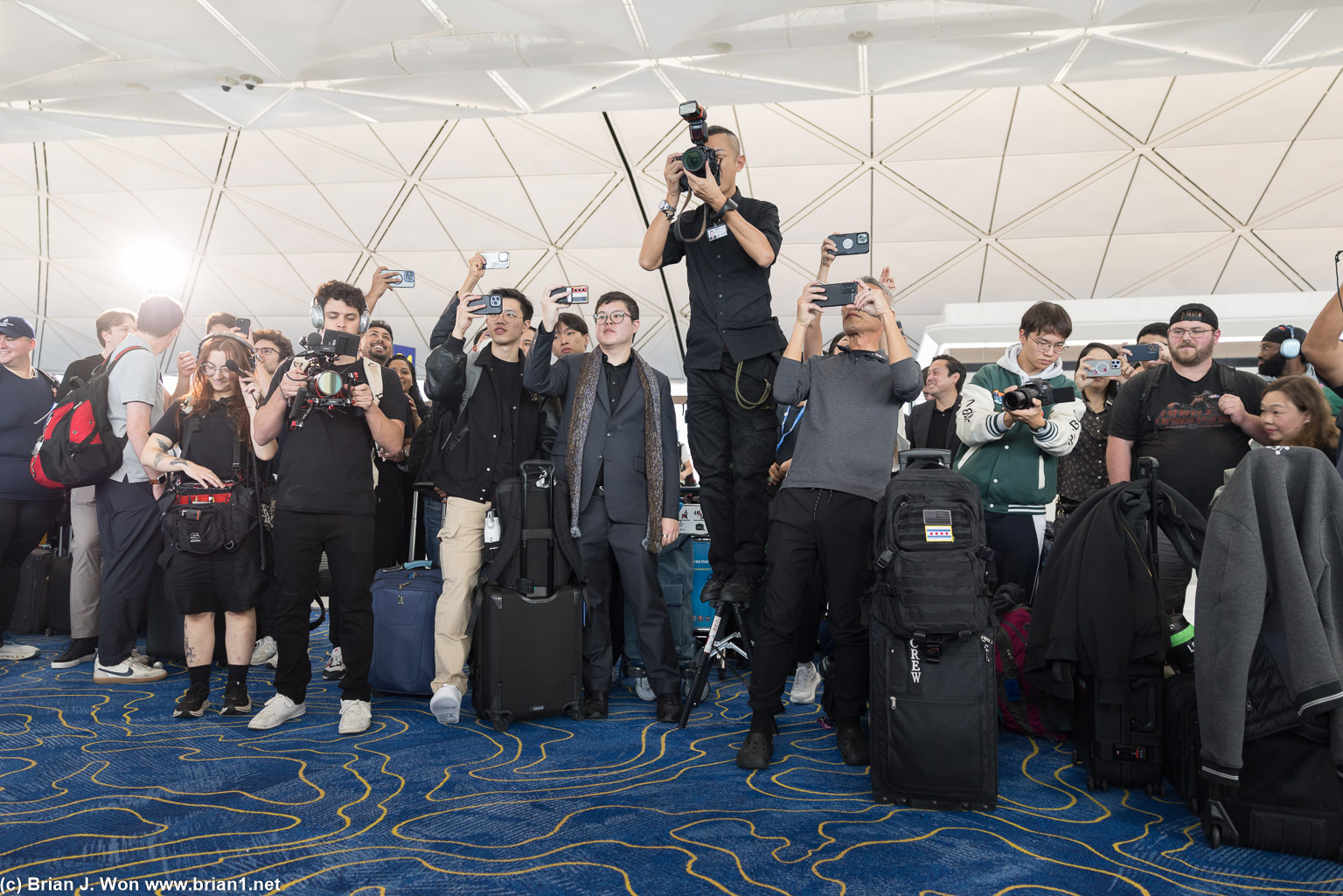 One official photographer and videographer, plus a ton of phones...