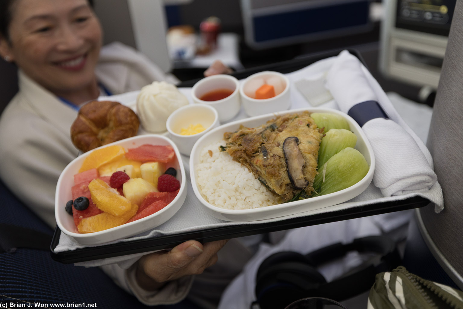 United flight attendant Jane shows off her chicken meal.