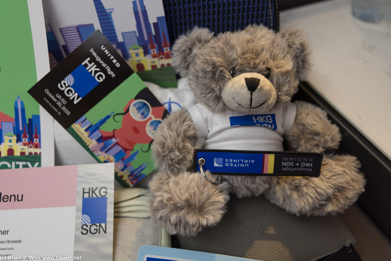 Inaugural flight teddy bear, keychain, and postcard.