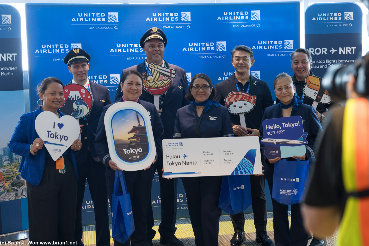 United VIPs and flight crew.