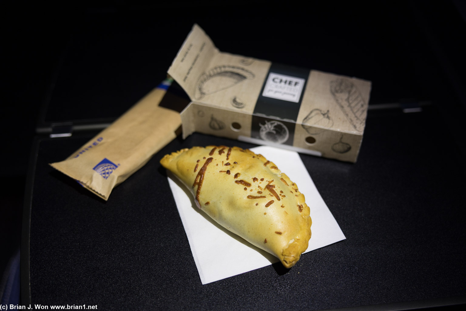 Spinach empanada for snack on IAD-LAX.